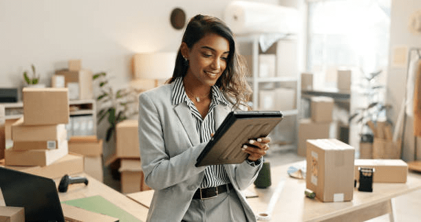 Reseller checking inventory manifest for amazon return pallets and warehouse deals