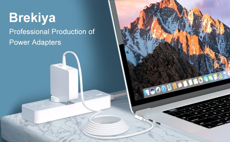 Student using a macbook air charger in a coffee shop for school work
