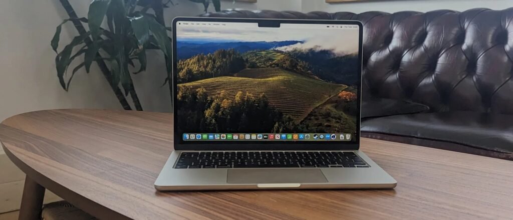 Sleek silver macbook air m3 sitting on a wooden desk showing high performance capabilities